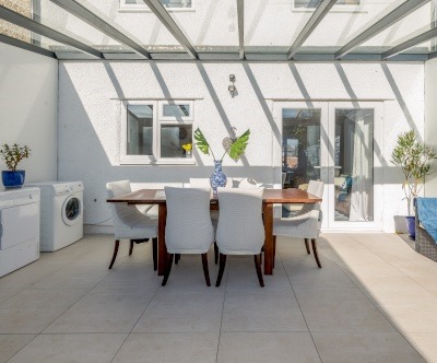 Sunroom with White Tiles