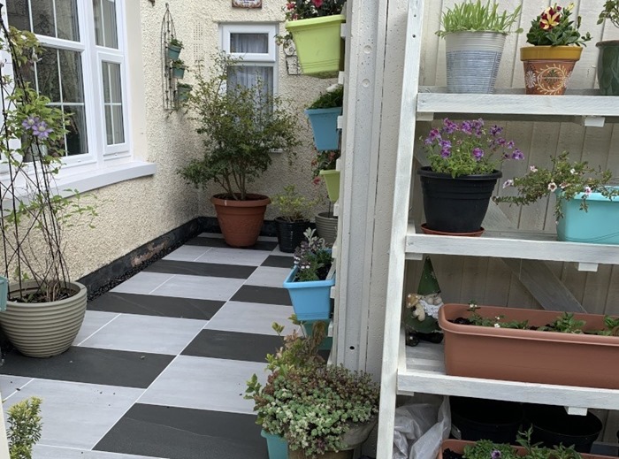 Black and white checkerboard patio paving